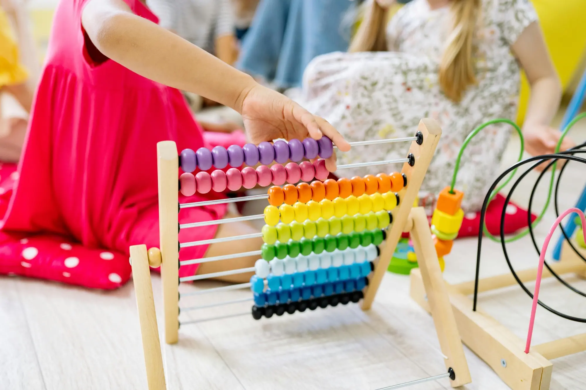 A child playing with an abacus