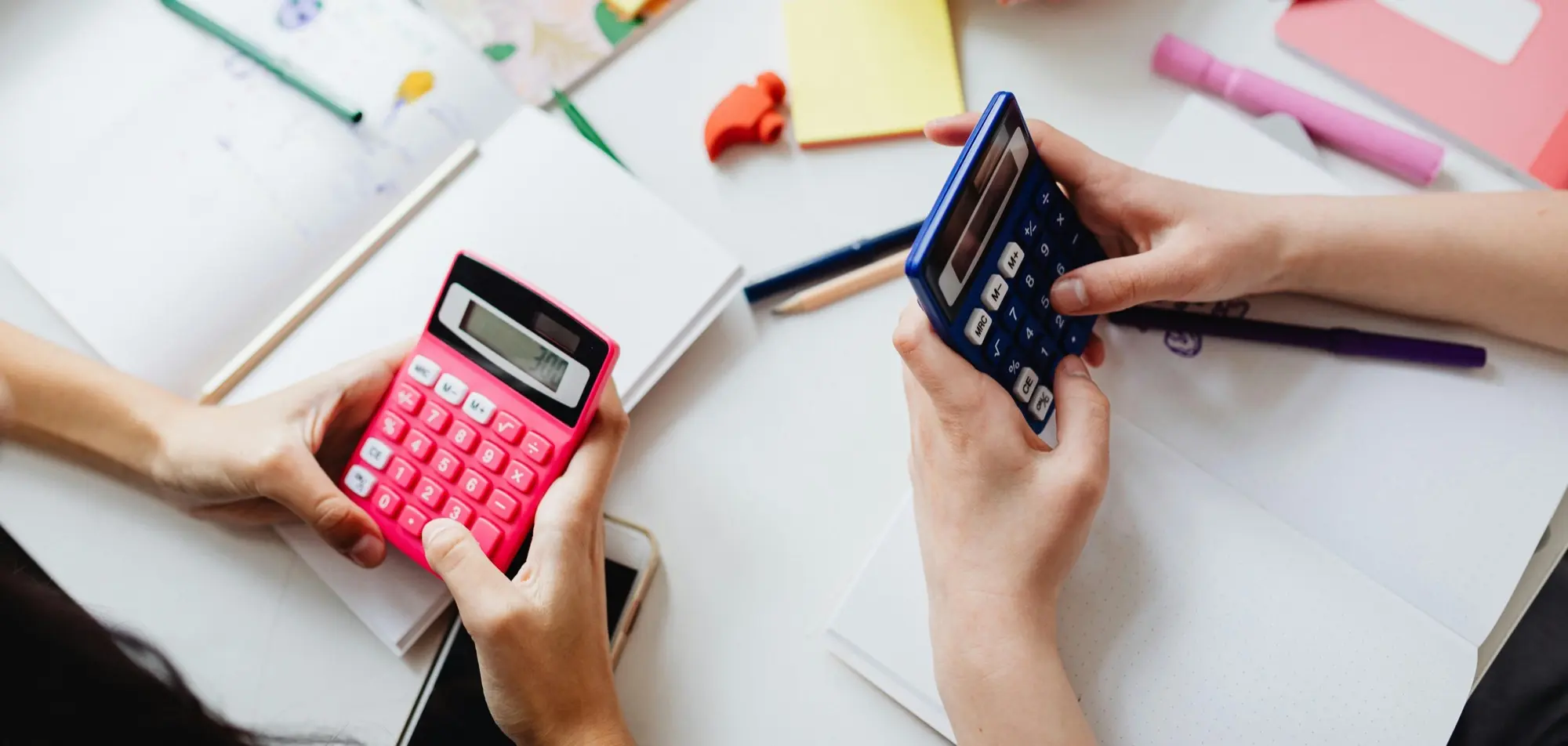 Two children working with calculators