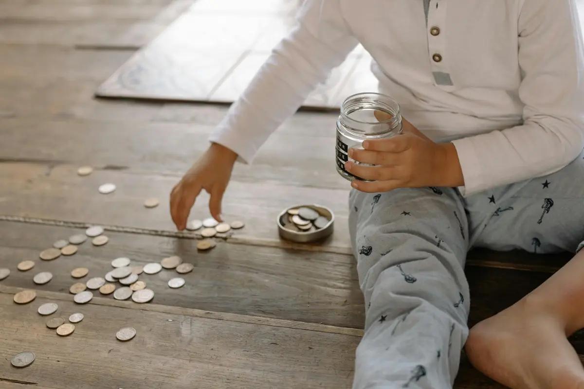 A child counting coins
