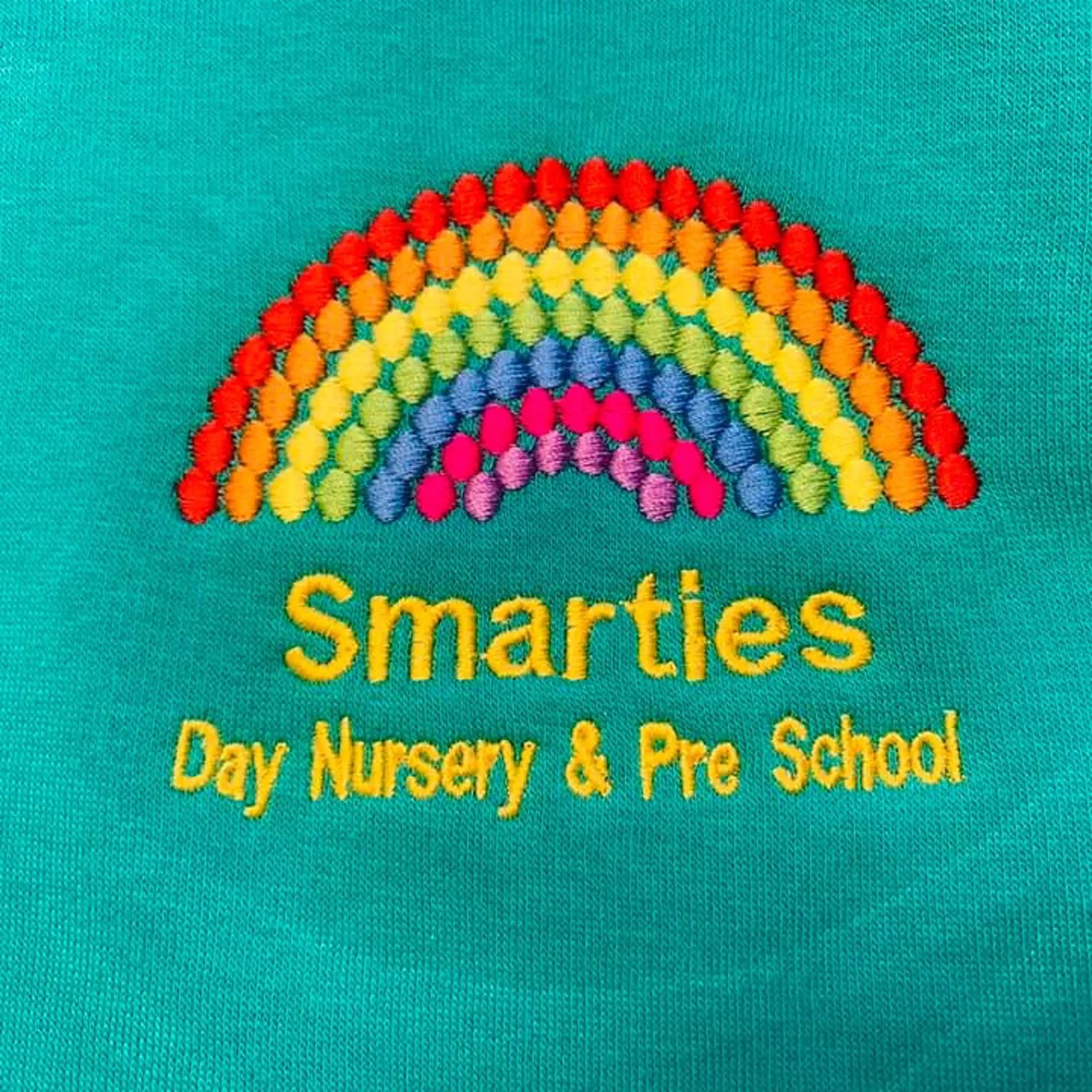 Smarties Nursery and Pre-school logo
